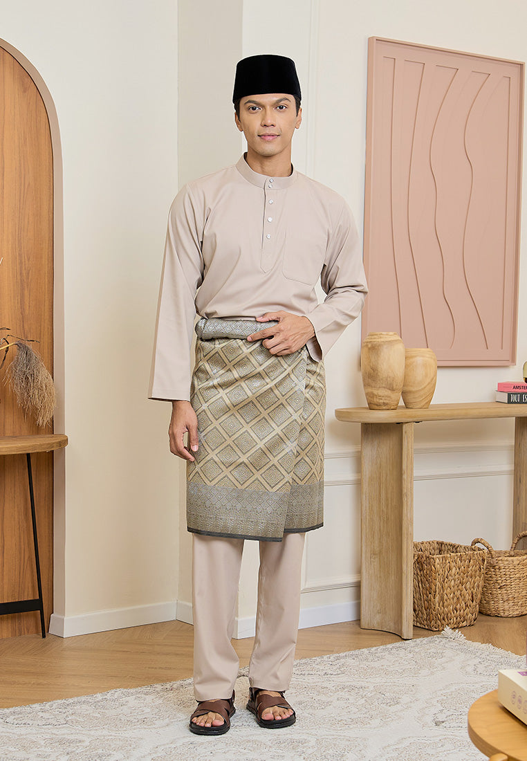 Man wearing a modern cotton Baju Melayu Cekak Musang in nude champagne with samping, songkok and magnetic button.